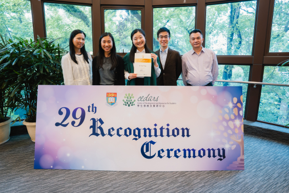 Student awardees celebrate their achievements with their loved ones, with joy and pride.